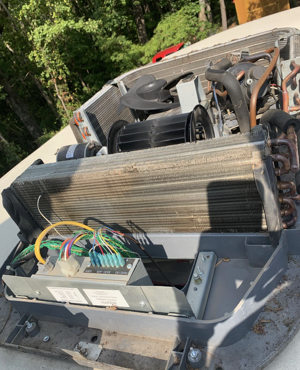 Rooftop RV air conditioner disassembled for deep service and cooling repair