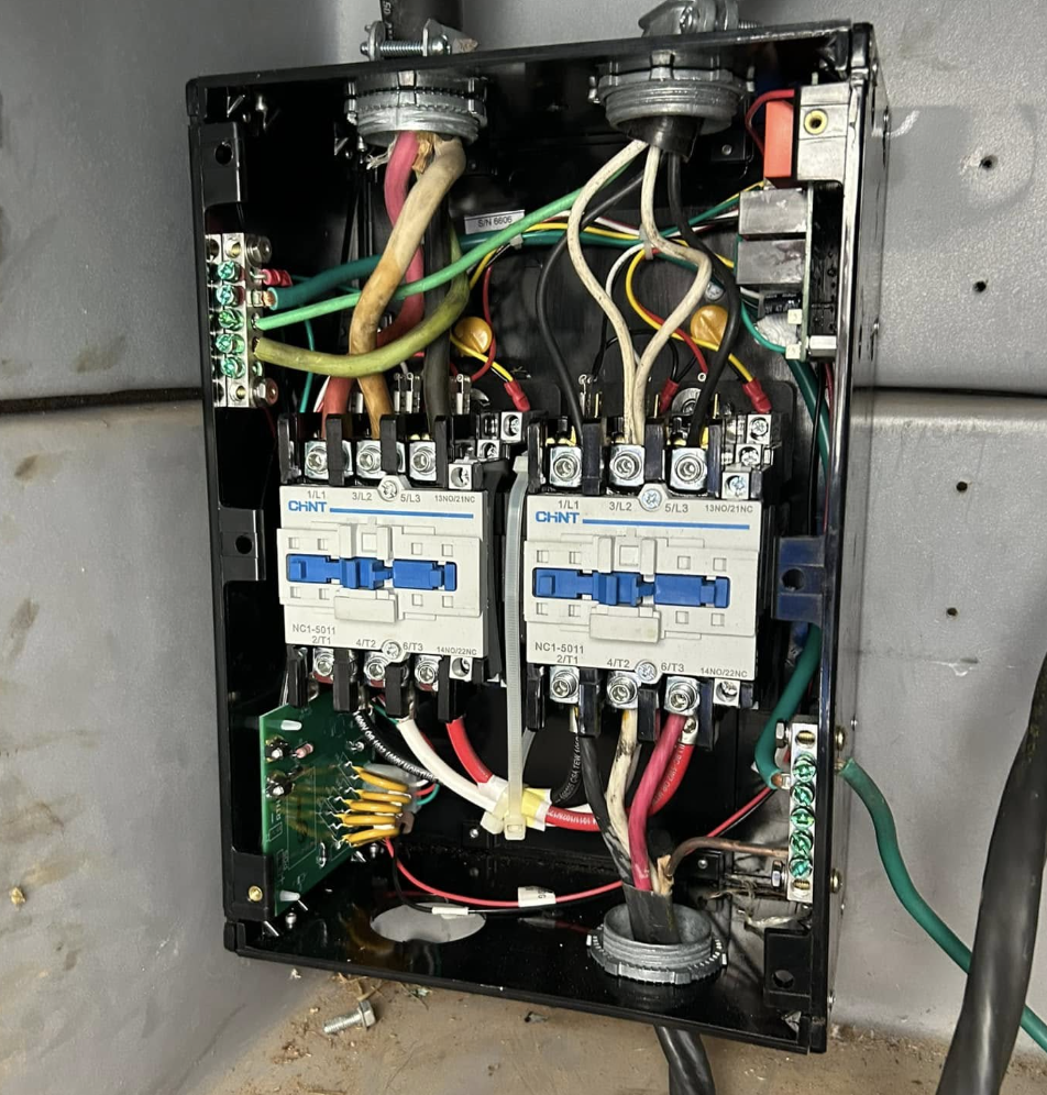 RV electrical control panel with wiring and contactors during diagnosis and repair